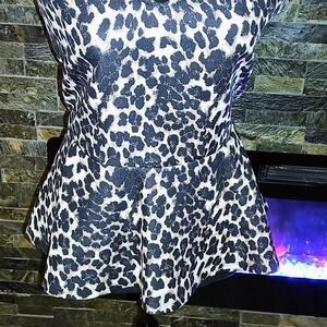 Stretchy cheetah Print Top with peplum Size XL